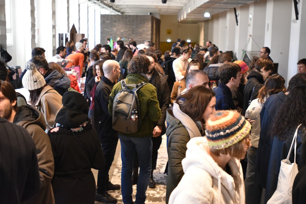 Long room full of people from the event in Milan